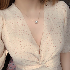 Tour de cou en cuir avec pendentif perle
